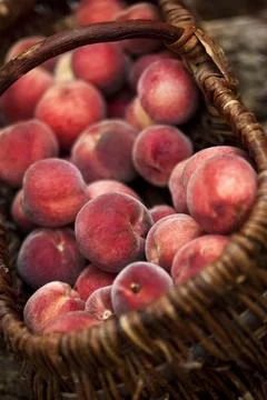 Peaches in a basket Stock Photos