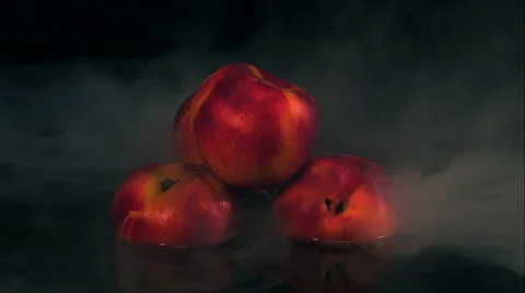 Peaches blowing up, exploding in slow motion isolated on black Stock Footage 64896111