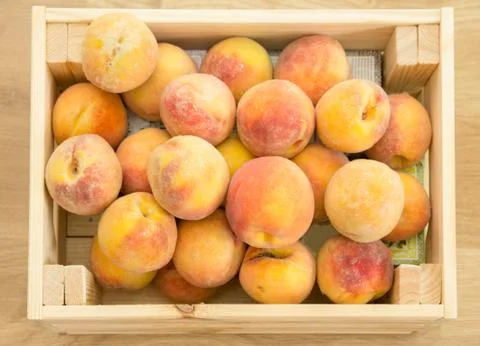 Peaches in box Stock Photos