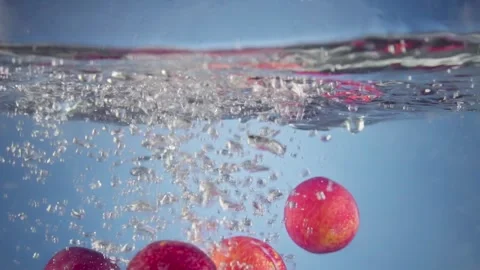 Peaches floating under water with bubbles. Stock Footage 300696636