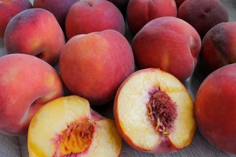 Peaches lying on the table close-up Stock Photos