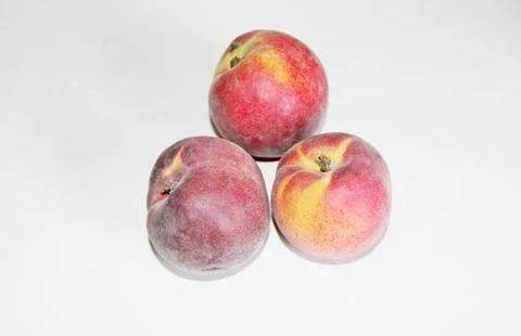 Peaches lying on the table on a white background Foto stock