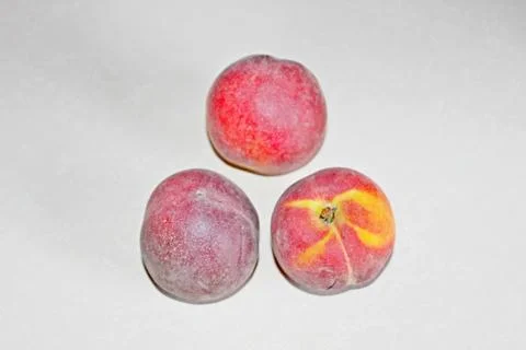 Peaches lying on the table on a white background Foto stock