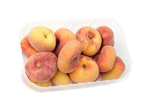Peaches in a plastic container. Stock Photos