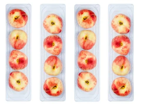 Peaches in plastic containers Stock Photos