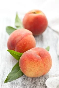 Peaches on rustic table. Stock Photos