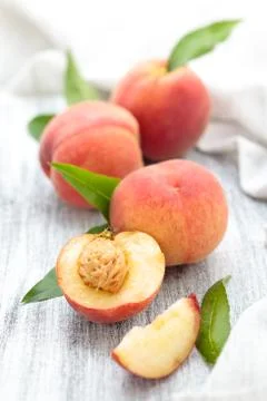 Peaches on rustic table. Stock Photos