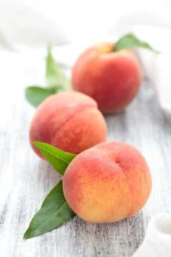 Peaches on rustic table. Stock Photos
