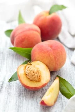 Peaches on rustic table. Stock Photos