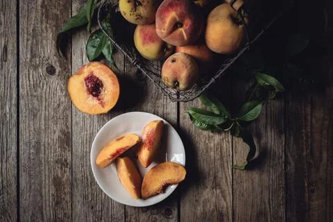 Peaches, top, view, fresh, fruit, table, basket, wood, slices, plate, flat .. Stock Photos