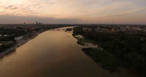Peak Of Bridge Over River At Orange Sunset. Aerial View Stock Footage 94733767