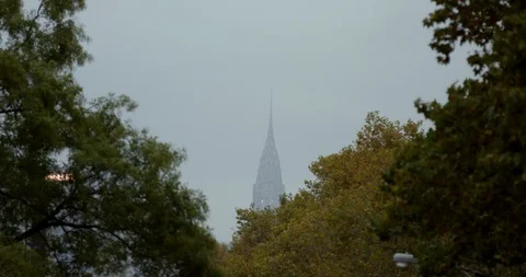 The Peak Of The Impressive  Empire State Building Surrounded By Autumn setting  Stock Footage 112600658