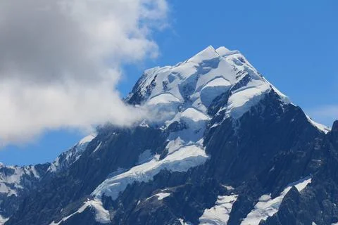 Peak of Mount Cook and cloud. Stock Photos