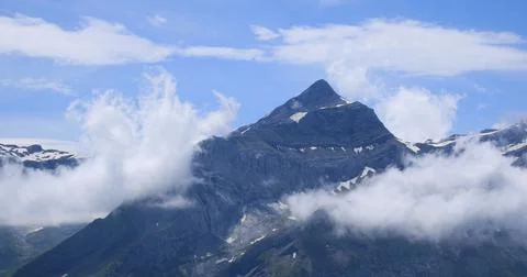 Peak of Mount Oldehore surrounded by clouds. Stock Photos