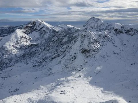 Peak of the mountain view and its valley with snow, italian alps, winter Stock Photos