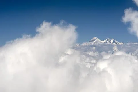 Peak of Mt Everest above clouds Stock Photos