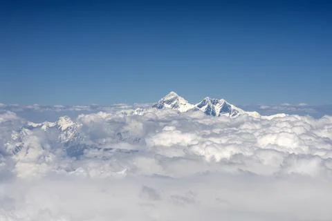 Peak of Mt Everest above clouds Stock Photos