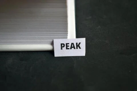 Peak Paper Tab Between Book Pages Symbolizing Excellence, Growth and Top Le.. Fotos Stock