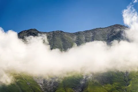 Peaks above the clouds Stock Photos