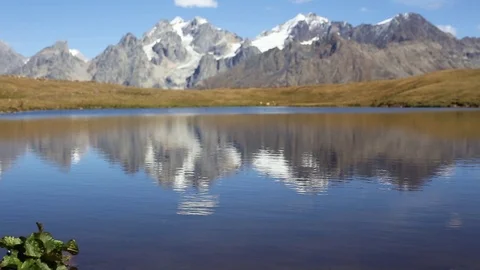 Peaks of the Caucasus reflecting in water Stock Footage 103622639