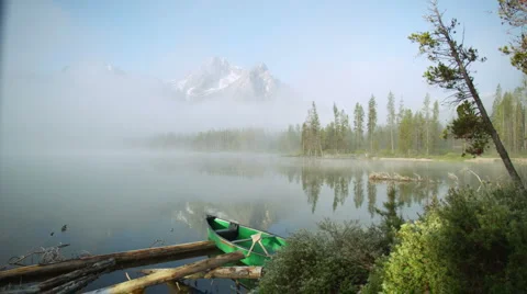 Peaks Lake Fog Canoe 55 Stock Footage