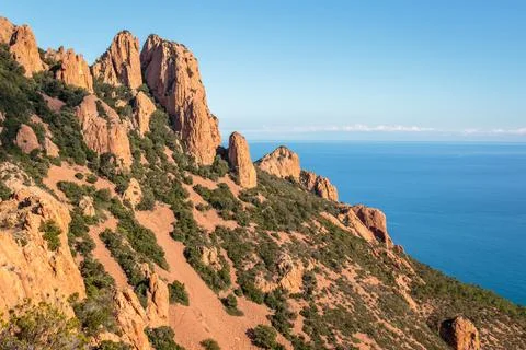 Peaks of a mountain range on the seashore Stock Photos