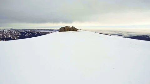 Peaks of mountains above the clouds Stock Footage 84775582