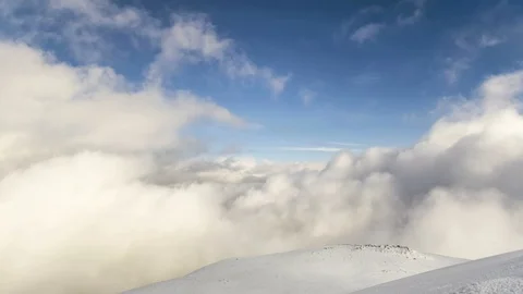 Peaks of mountains above the clouds Stock Footage 86290566