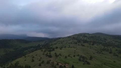 Peaks of mountains among rain clouds Video stock 137545404