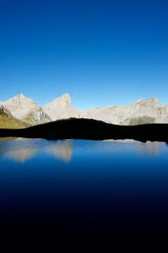 Peaks reflected in Ansabere Lake Stock Photos