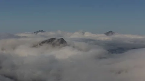 Peaks stick out of clouds,4k,timelapse Stock Footage 230212973