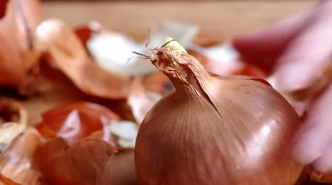 Pealing onions for cooking Stock Footage 45884156