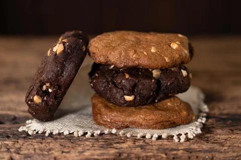 Peanut and chocolate cookies stack on wood table. Stock Photos