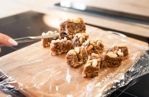 Peanut Bar Cooking Process in Chocolate Glaze Fotos de archivo