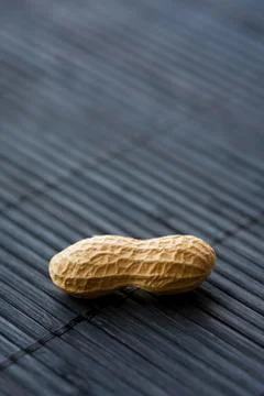 Peanut on black, close-up Stock Photos