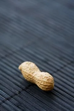 Peanut on black, close-up Stock Photos