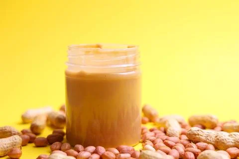 Peanut butter on a colored background Stock Photos