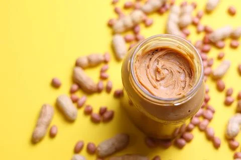 Peanut butter on a colored background Stock Photos