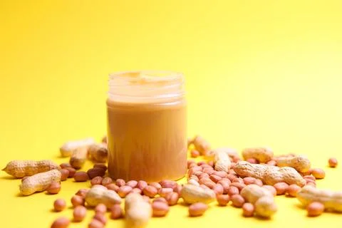 Peanut butter on a colored background Stock Photos
