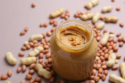 Peanut butter on a colored background Stock Photos