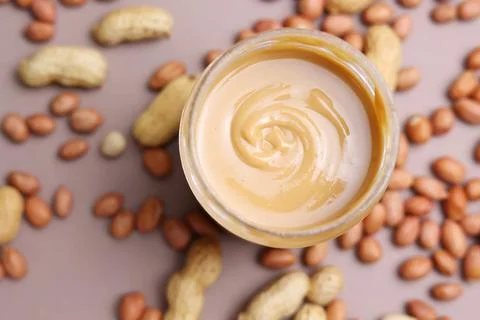 Peanut butter on a colored background Foto stock
