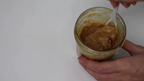 Peanut butter in a jar Vídeo Stock 142475639