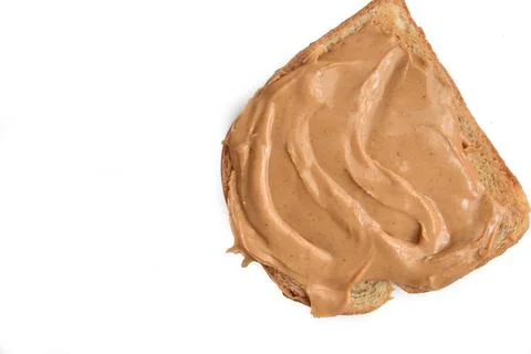 Peanut butter on a slice of bread Stock Photos