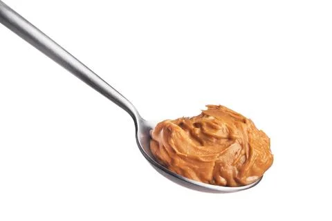 Peanut butter on a spoon Stock Photos