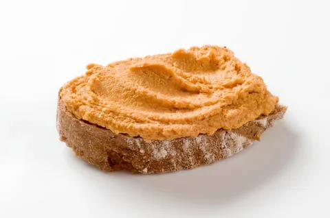 Peanut butter spread on bread slice Stock Photos