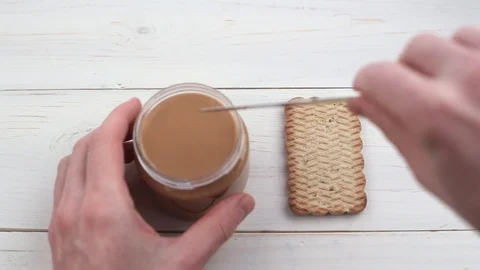 Peanut butter spread on cookies Stock Footage 103531689