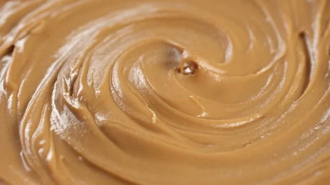 Peanut Butter Spreading close up, rotation Video stock 282439072