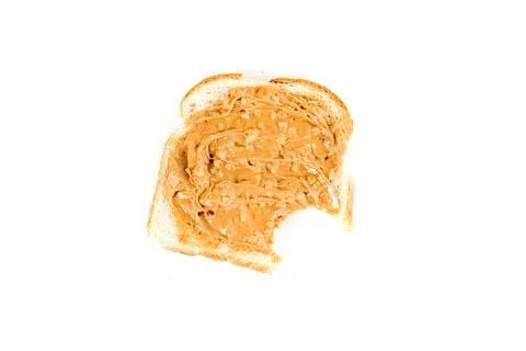 Peanut buttered toasted bread witih a bite out isolated over white Stock Photos