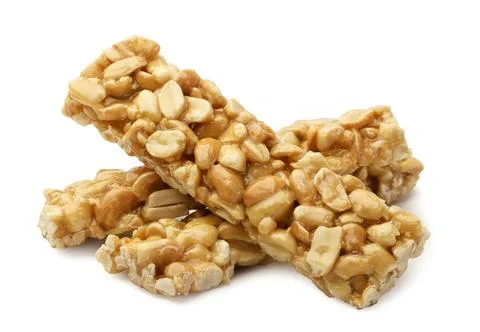Peanut caramel bars close-up on a white. Isolated Stock Photos
