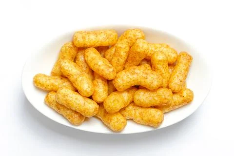 Peanut flips, puffed peanut-flavored corn snack, in a white bowl Stock Photos